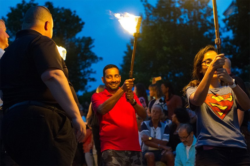 People with torches for PVD WaterFire