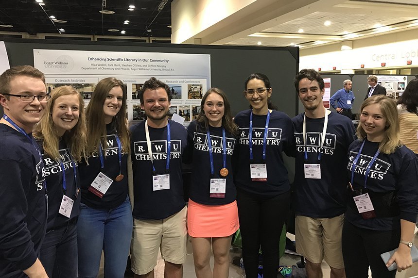 Students pose with research 