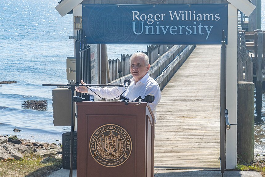 Senator Reed speaks at a podium.