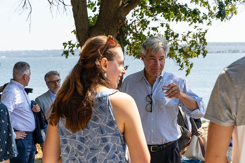 Senator Whitehouse talks to people at the RWU event.