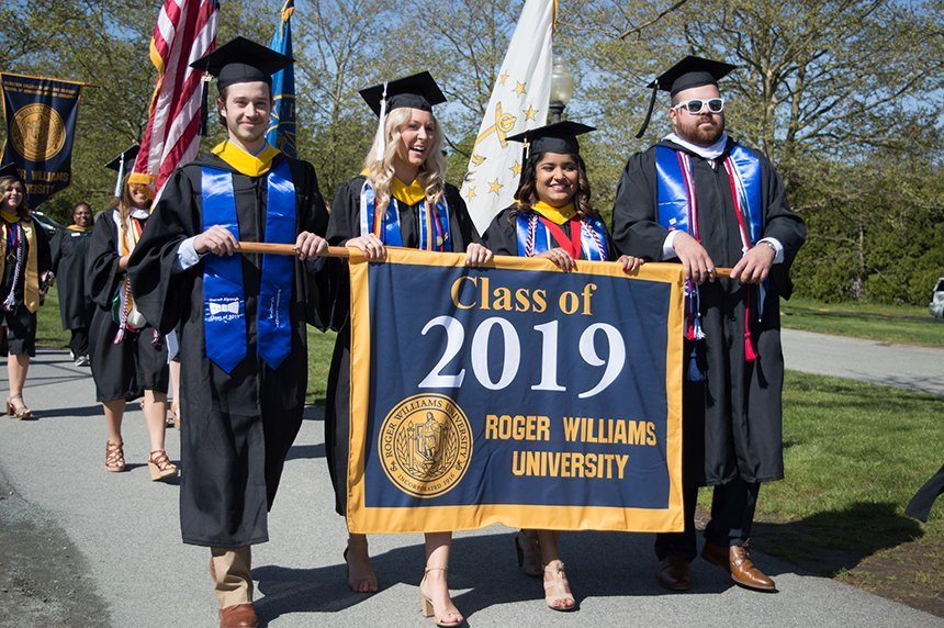 image of members of RWU Class of 2019 bearing class banner