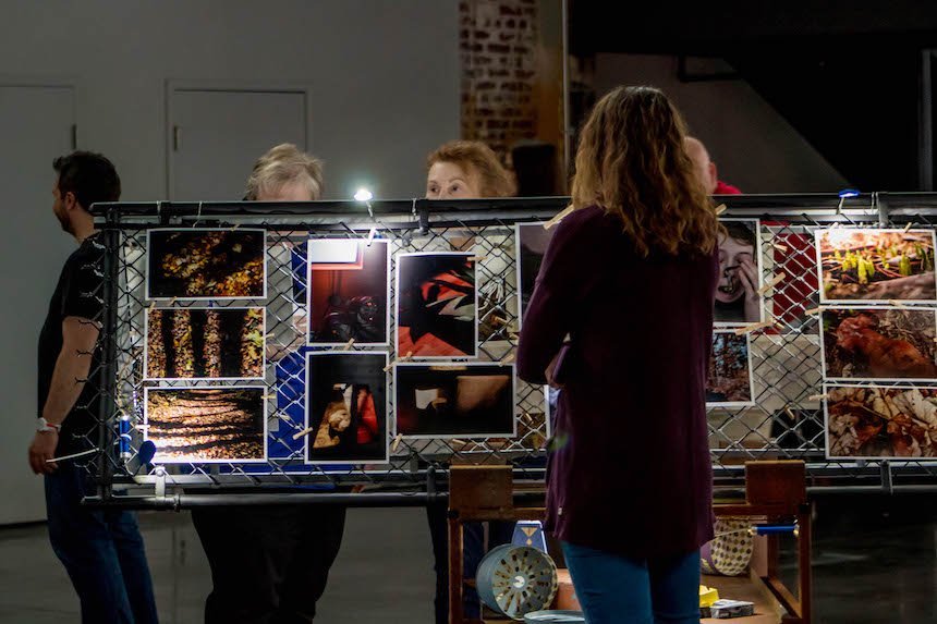 People looking at photographs. 