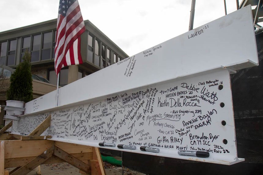 The steel beam adorned with signatures.