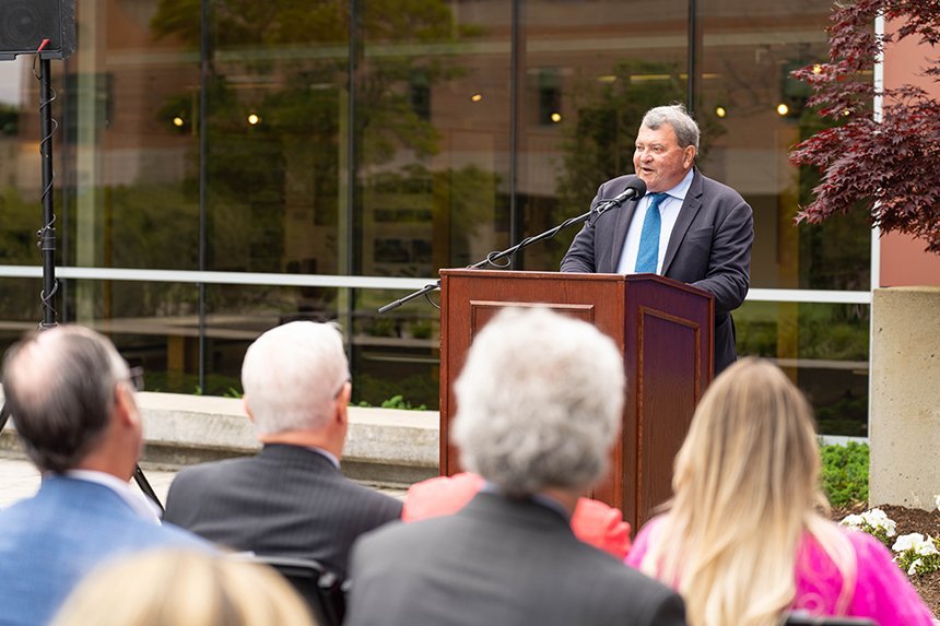 President Ioannis Miaoulis speaking at the podium 