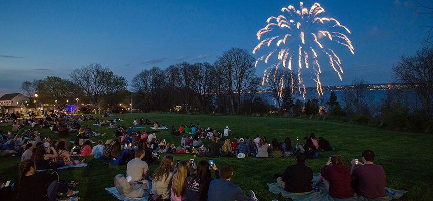 Students on campus watching fireworks