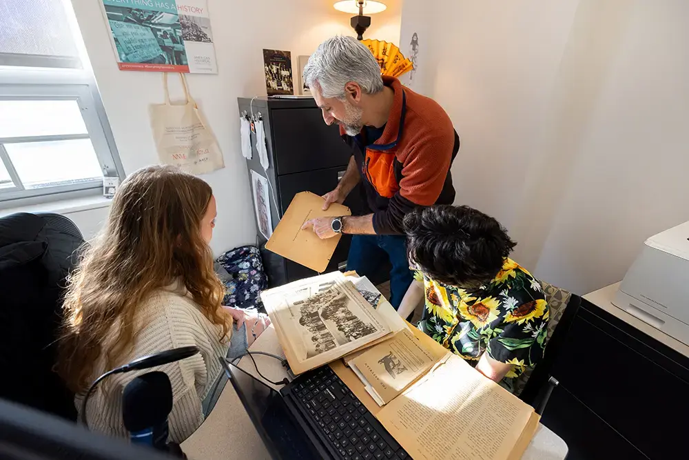 Students collaborate with professor