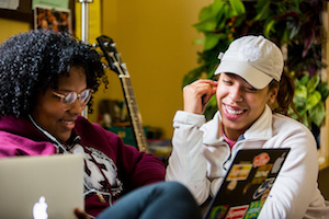 students looking at computer